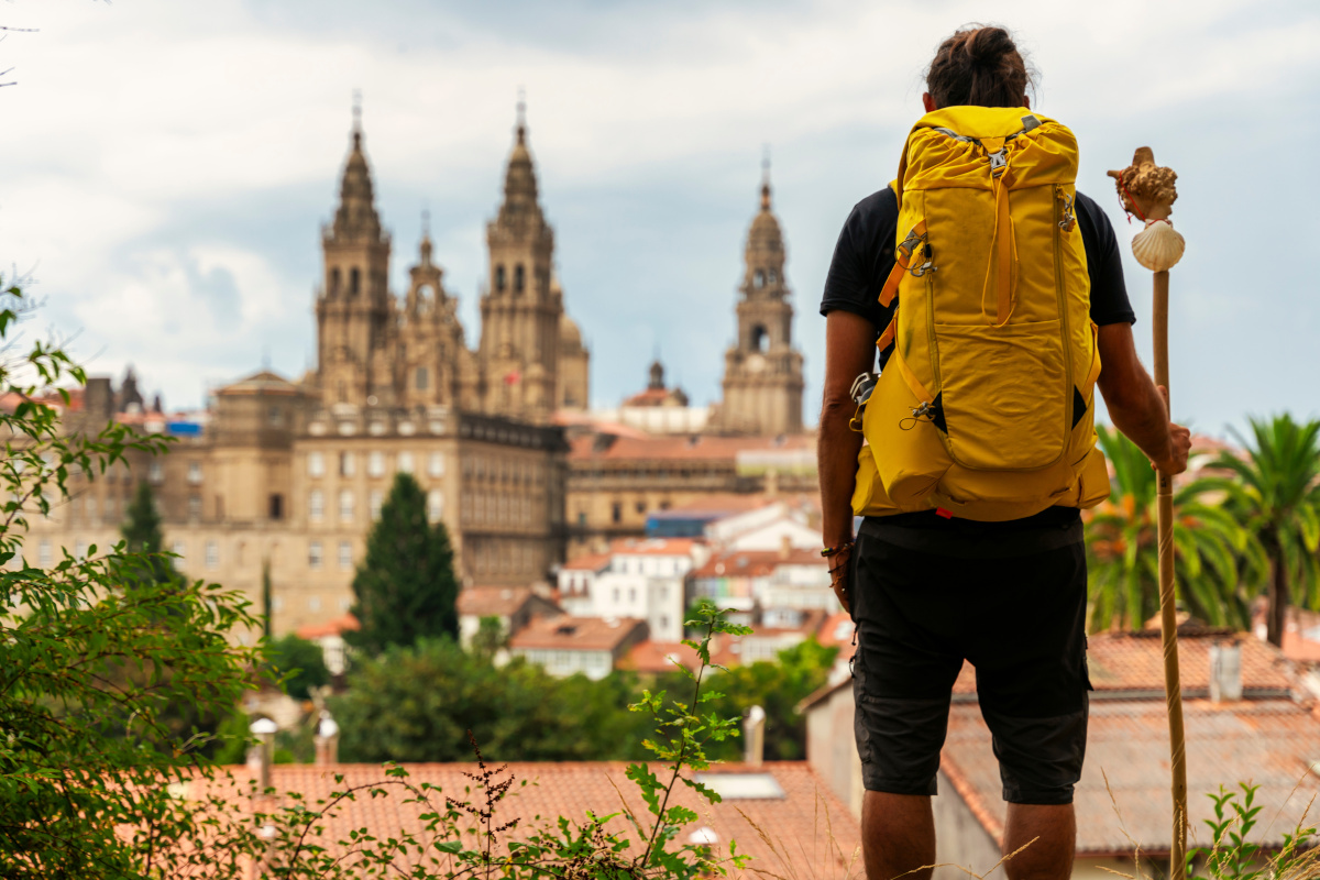 pilgrim looking at the cathedral of Santiago de Compostela