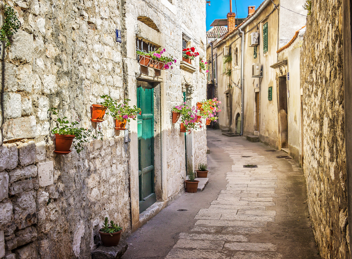 Narrow old street and yard in Sibenik city, Croatia,