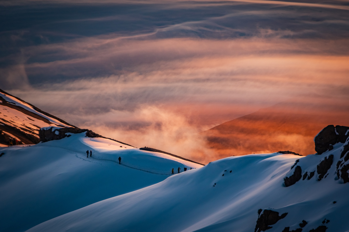Hikers on the Kilimanjaro crater rim at sunrise