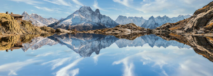 Reflection of Mont Blanc on lake in high mountains in the French Alps,