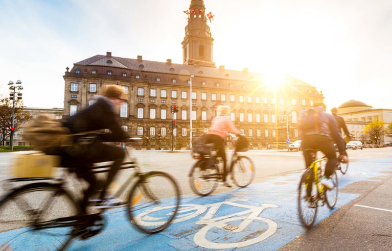 Travelers bike on Copenhagen street bike lane