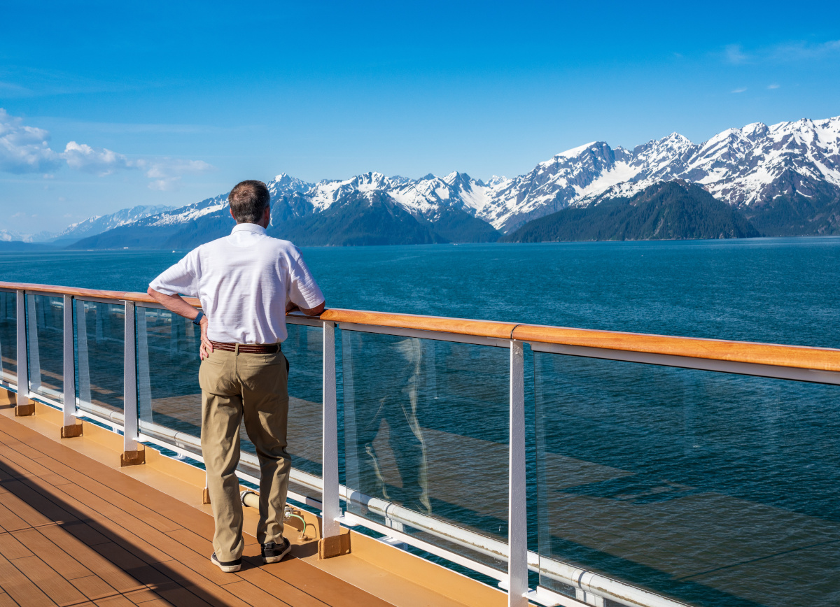 senior man on deck as cruise ship departs